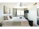 Comfortable bedroom with ceiling fan, TV, decor, and a bright window view at 4620 N 68Th St # 117, Scottsdale, AZ 85251