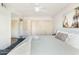 Bright bedroom featuring dual closets, ceiling fan, and wood-look flooring at 4620 N 68Th St # 117, Scottsdale, AZ 85251