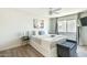 Sunny bedroom featuring ceiling fan, bright window and stylish decor at 4620 N 68Th St # 117, Scottsdale, AZ 85251