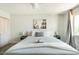 Relaxing bedroom featuring ceiling fan, closet, window and stylish decor at 4620 N 68Th St # 117, Scottsdale, AZ 85251