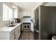 Modern kitchen featuring stainless steel appliances, white cabinets, and quartz countertops at 4620 N 68Th St # 117, Scottsdale, AZ 85251
