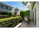 Outdoor patio featuring seating area surrounded by manicured greenery at 4620 N 68Th St # 117, Scottsdale, AZ 85251