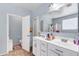 The bathroom features double sinks and tile flooring at 4895 E Amarillo Dr, San Tan Valley, AZ 85140