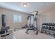 Exercise room featuring weightlifting equipment, a rowing machine, and a punching bag at 532 N 102Nd Pl, Mesa, AZ 85207