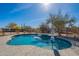 Backyard pool with a relaxing waterfall feature for enjoying warm days under the sun at 532 N 102Nd Pl, Mesa, AZ 85207