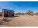 View of the red barn with an open area ready for animals at 532 N 102Nd Pl, Mesa, AZ 85207