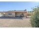 Charming single-story home with a stone facade, covered porch, and desert landscaping at 541 W Edgemont Ave, Phoenix, AZ 85003