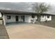 Single-story home with a covered carport and well-maintained landscaping, perfect for comfortable living at 5910 E Colby St, Mesa, AZ 85205