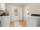 Functional laundry room with washer, dryer, and exterior access at 5910 E Colby St, Mesa, AZ 85205