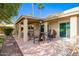 Backyard patio with outdoor furniture, grill, and view of the landscape, perfect for outdoor living and entertaining at 619 S Desert Flower Dr, Mesa, AZ 85208