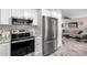 Kitchen featuring stainless steel appliances and gray countertops at 619 S Desert Flower Dr, Mesa, AZ 85208