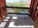 This balcony overlooks the mountains and features a small white table at 639 W Us Highway 60 Hwy, Superior, AZ 85173
