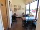 Dining area with tables, chairs, large windows, and an 'Employees Only' door at 639 W Us Highway 60 Hwy, Superior, AZ 85173