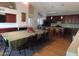 A dining room with a fireplace and a long table and chairs that seats 14 at 639 W Us Highway 60 Hwy, Superior, AZ 85173