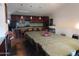 A dining room with a fireplace and a long table and chairs that seats 14 at 639 W Us Highway 60 Hwy, Superior, AZ 85173