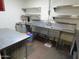 Commercial kitchen with multiple sinks and stainless steel surfaces for food preparation at 639 W Us Highway 60 Hwy, Superior, AZ 85173