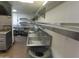 Kitchen area with stainless steel sinks, shelving, and a commercial-grade setup at 639 W Us Highway 60 Hwy, Superior, AZ 85173