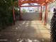 Covered patio space with concrete flooring, an orange framework, and a partially visible fence at 639 W Us Highway 60 Hwy, Superior, AZ 85173