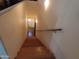 A long staircase leading down into the house with wooden steps and lighting at 639 W Us Highway 60 Hwy, Superior, AZ 85173