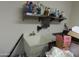 A utility sink with a stainless steel shelf above, ideal for laundry or cleaning supplies at 639 W Us Highway 60 Hwy, Superior, AZ 85173