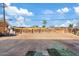 Large, sunny backyard with a wooden fence, potential for landscaping, and outdoor enjoyment at 724 S Lewis --, Mesa, AZ 85210