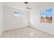 Bright bedroom with tile floors and two sunny windows at 724 S Lewis --, Mesa, AZ 85210