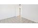 Neutral bedroom featuring tiled flooring, and an open doorway at 724 S Lewis --, Mesa, AZ 85210