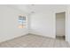 Bedroom featuring tiled floors and natural light with view of adjacent room at 724 S Lewis --, Mesa, AZ 85210