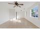 Bright living room with tile floors, white walls, and natural light streaming through the windows at 724 S Lewis --, Mesa, AZ 85210