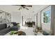 Bright and airy living room with a modern ceiling fan, neutral tones, and cozy seating at 724 S Lewis --, Mesa, AZ 85210