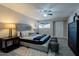 Inviting main bedroom with a tufted headboard, ceiling fan, and stylish decor at 753 W 6Th Dr, Mesa, AZ 85210