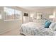 Serene bedroom with a leafy view from the window and stylish white furniture at 8155 E Roosevelt St # 112, Scottsdale, AZ 85257