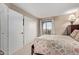 Bright bedroom featuring a large closet and a sliding glass door to the balcony at 8155 E Roosevelt St # 112, Scottsdale, AZ 85257