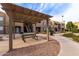 Community common area with covered picnic table and walkway at 8155 E Roosevelt St # 112, Scottsdale, AZ 85257