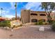 Exterior view of Pueblos of Scottsdale community showing landscaped entrance and building facade at 8155 E Roosevelt St # 112, Scottsdale, AZ 85257