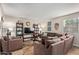 Spacious living room featuring a large comfortable sofa and stylish decor at 8155 E Roosevelt St # 112, Scottsdale, AZ 85257
