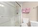 Bathroom featuring glass-enclosed shower with modern fixtures and well-organized towel rack at 8155 E Roosevelt St # 112, Scottsdale, AZ 85257