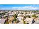 Wide aerial shot showcasing a Gathering-friendly neighborhood with diverse homes under a blue sky at 8812 N 67Th Dr, Peoria, AZ 85345