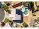 An aerial view of a private backyard pool and a home with solar panels at 8812 N 67Th Dr, Peoria, AZ 85345