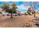 This home boasts a large backyard, a pool, covered patio, mature trees, and gravel landscaping for easy maintenance at 8812 N 67Th Dr, Peoria, AZ 85345