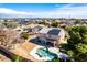 Aerial view of the backyard showcasing a private swimming pool, covered patio, and desert landscaping at 8812 N 67Th Dr, Peoria, AZ 85345