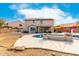 A charming two-story home features a refreshing pool, solar panels, and a patio in a spacious backyard at 8812 N 67Th Dr, Peoria, AZ 85345