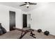 Bedroom with exercise equipment and a black ceiling fan at 8812 N 67Th Dr, Peoria, AZ 85345
