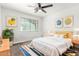 Bright bedroom with sunny window, colorful accents, and modern decor at 8812 N 67Th Dr, Peoria, AZ 85345