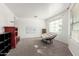 A cozy room filled with natural light, carpeted floor, and a comfortable chair at 8812 N 67Th Dr, Peoria, AZ 85345