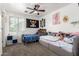 Bedroom featuring two beds, ceiling fan, and a window with natural light at 8812 N 67Th Dr, Peoria, AZ 85345