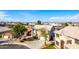 Attractive two-story house with a two-car garage, mature trees, and tidy desert landscaping at 8812 N 67Th Dr, Peoria, AZ 85345