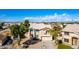 Charming two-story home with a well-manicured front yard, desert landscaping, and a two car garage at 8812 N 67Th Dr, Peoria, AZ 85345