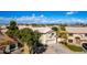 Inviting two-story home featuring a two-car garage, manicured lawn, and charming curb appeal at 8812 N 67Th Dr, Peoria, AZ 85345