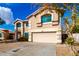 Two story home featuring an attached two car garage and well-kept yard at 8812 N 67Th Dr, Peoria, AZ 85345
